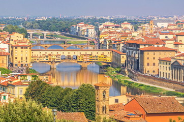 Fototapeta na wymiar View of promenade and bridges over Arno River in Florence