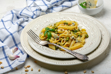 Delicious pasta with green peas and blue cheese.