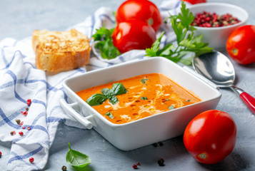 Tomato soup with green basil.