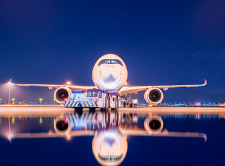 aircraft ready to departure with reflection - obrazy, fototapety, plakaty