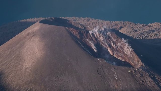 Smoking mount Barujari (active volcano), post-caldera cone in a lake inside of Rinjani crater, Lombok, Indonesia