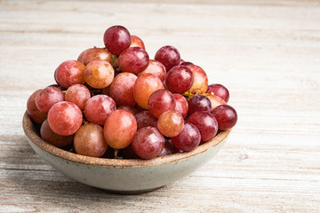 Grapes In A Bowl On Wood Table