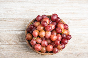 Grapes In A Bowl On Wood Table