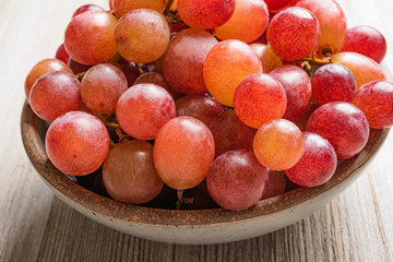 Grapes In A Bowl On Wood Table