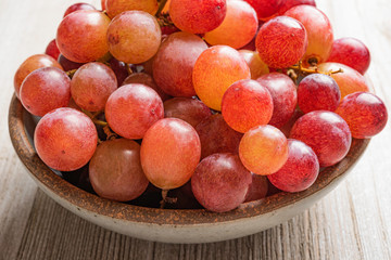 Grapes In A Bowl On Wood Table