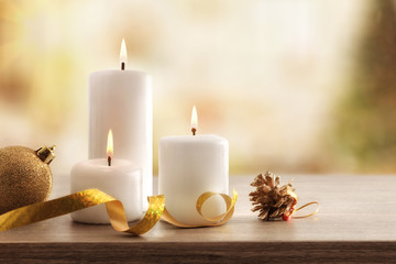 Christmas religious holiday card with burning candles in room