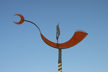 Weather vane on an old building in the Spanish city of Seville