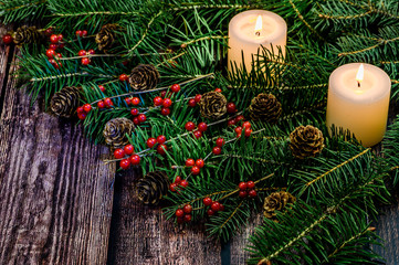 Decorated christmas tree branch on wooden table