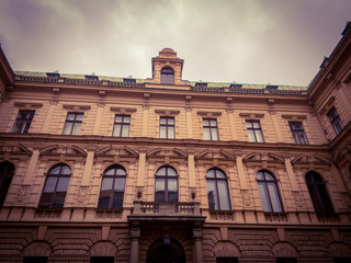 Fototapeta na wymiar Facade of an old university building in a European city