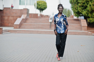 Young black female posed in the city. African women single portrait.
