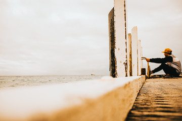 contemplating in thought at the beach 