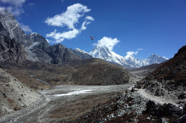 Everest trek, Helicopter flying over valley and trail between Dughla (4620 m) and Lobuche (4910 m)...