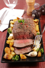 roast beef with potato, garlic and sauce