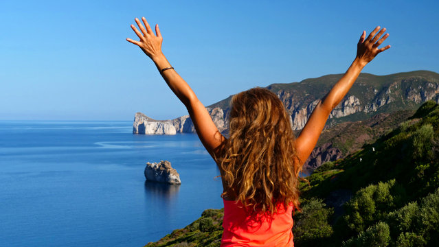 woman with arms in the air- healthy lifestyle, sport and vacation concept