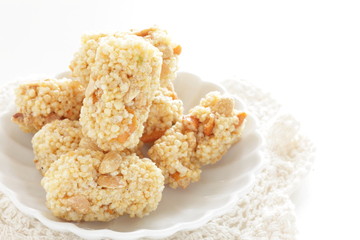 Asian confectionery, rice cracker on dish with copy space