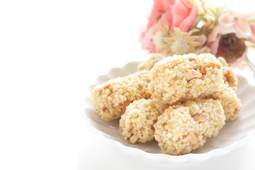 Asian confectionery, rice cracker on dish with copy space