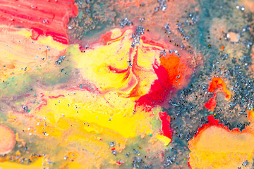 Beautiful colorful background with glitter and colored bubbles in oil and watercolor. Sparkle particles. Macro oil ink bubbles and drops. Abstract template acrylic paint texture. Colored Wallpaper 