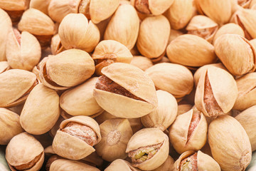 Tasty pistachio nuts as background