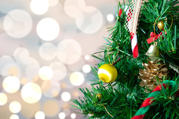 Front view,decorated Christmas tree on blurred light bokeh background and copy space for text.