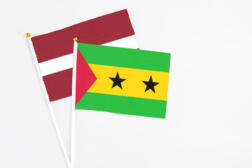 Sao Tome And Principe and Latvia stick flags on white background. High quality fabric, miniature...