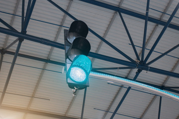 Modern traffic light shines green