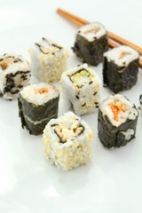 several makis on a white background	