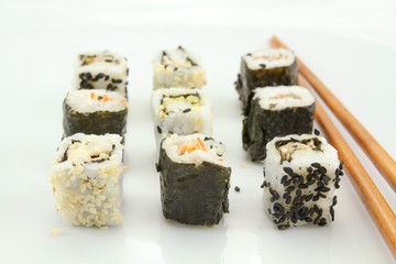 several makis on a white background	