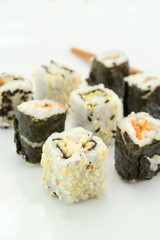 several makis on a white background	