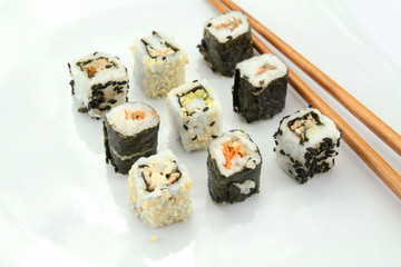 several makis on a white background	