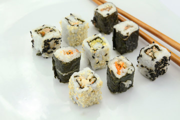 several makis on a white background	