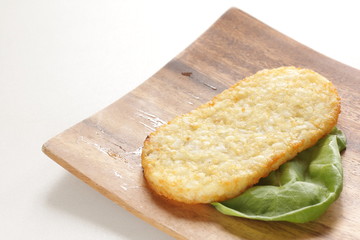 Hash brown on wooden plate for breakfast image