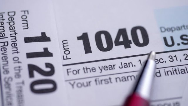 USA tax form 1040, 1120, close up.