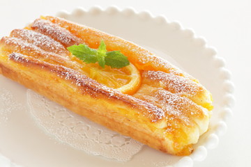 Orange pastry bread on dish