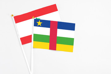 Central African Republic and Lebanon stick flags on white background. High quality fabric, miniature national flag. Peaceful global concept.White floor for copy space.