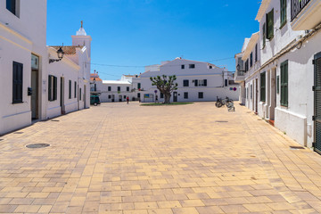View of Traditional Spanish street in city of island Menorca - obrazy, fototapety, plakaty