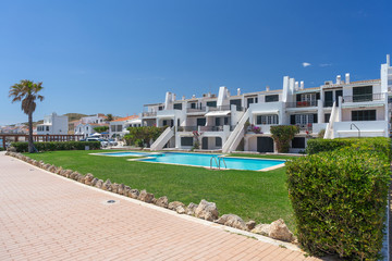 Fototapeta premium View of Traditional Spanish street in city of island Menorca