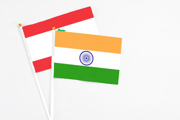 India and Lebanon stick flags on white background. High quality fabric, miniature national flag. Peaceful global concept.White floor for copy space.