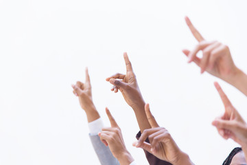 Hands of businesspeople pointing index fingers up. Isolated arms on white background. Training or direction concept