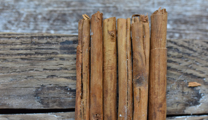cinnamon sticks Ceylon powdered sugar on a wooden table