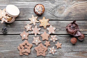 Christmas tree shape made of tasty cookies on wooden background