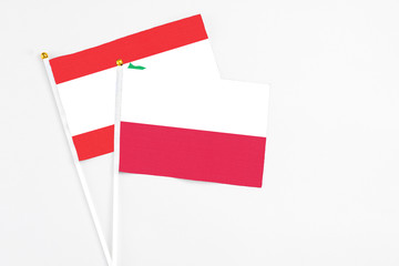 Poland and Lebanon stick flags on white background. High quality fabric, miniature national flag....