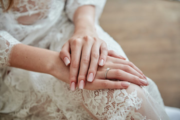 Close up of woman hands with pastel wedding manicure, copy space