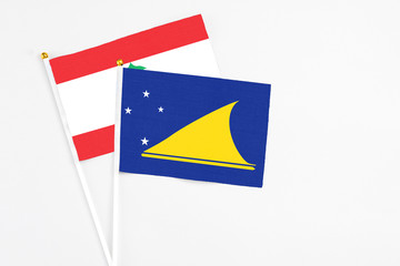 Tokelau and Lebanon stick flags on white background. High quality fabric, miniature national flag....