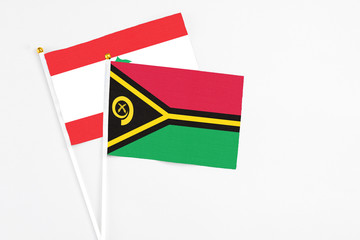 Vanuatu and Lebanon stick flags on white background. High quality fabric, miniature national flag....