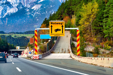 Emergency lane for trucks whose brakes fail on the mountain. (Notweg! Zufahrt und Bremsweg...