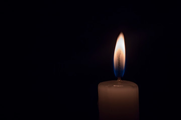 candle burning in the dark