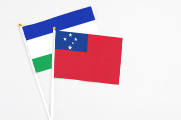 Samoa and Lesotho stick flags on white background. High quality fabric, miniature national flag....
