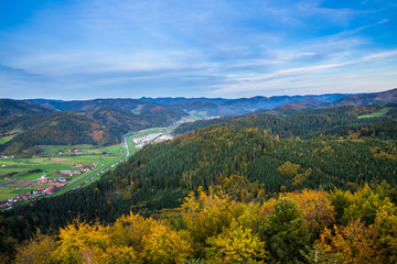Fototapeta na wymiar Germany, Endless view over tree tops of black forest village hausach im kinzigtal valley surrounded by colorful autumn season forest breathtaking nature landscape