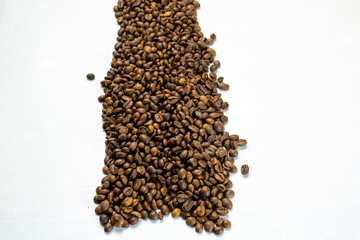coffee beans sprinkled on a table isolated on a white background