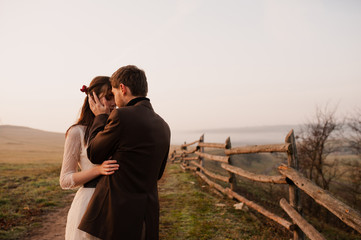 farewell hugs of a guy and a girl. evening. frame from the movie. book cover